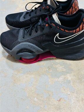 Nike Women’s Black Training Shoes with Pink and Orange Accents